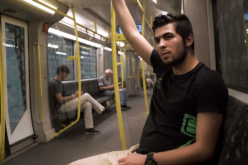 Syrian refugee Alaa Taan on the Berlin subway.