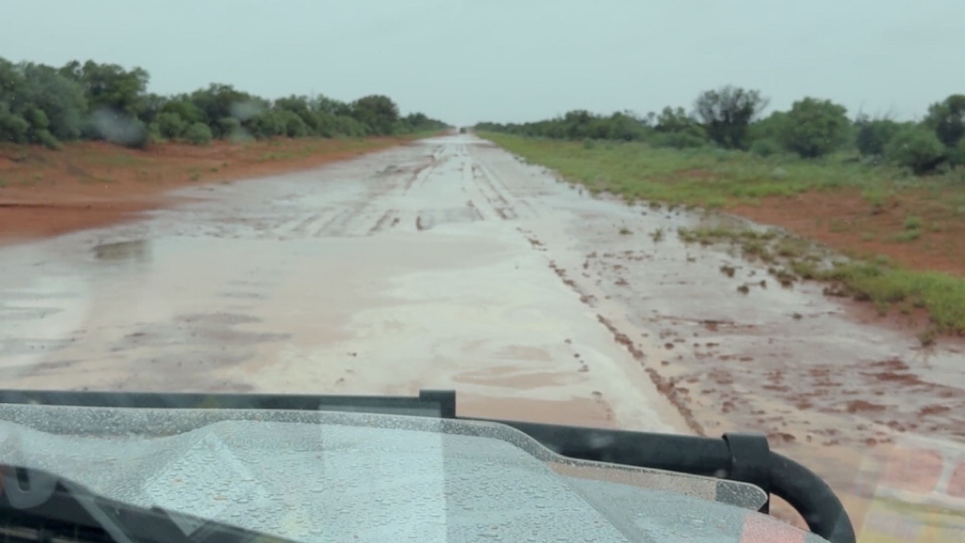 Flooded road in outback NSW during rain event