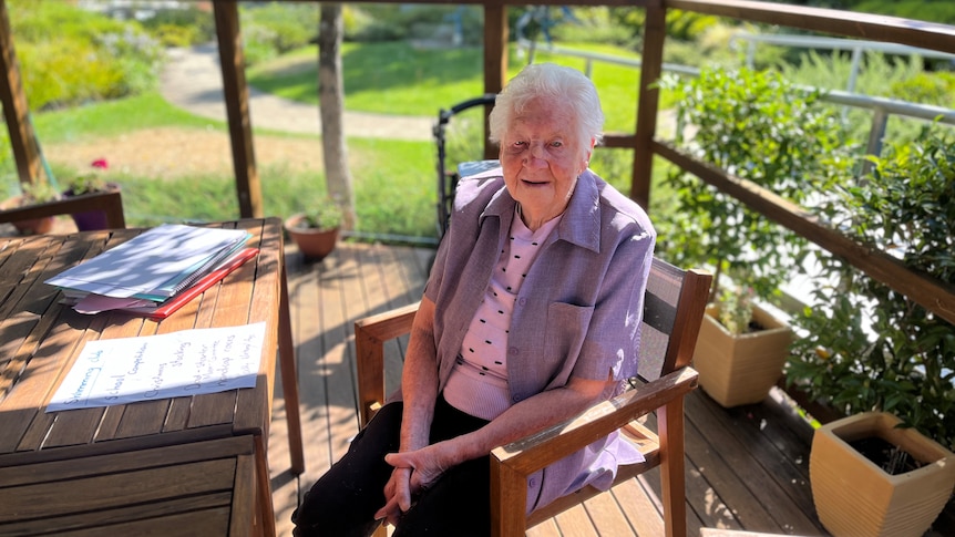 97 year old Nita Davey sits in a lovely garden in New Norfolk