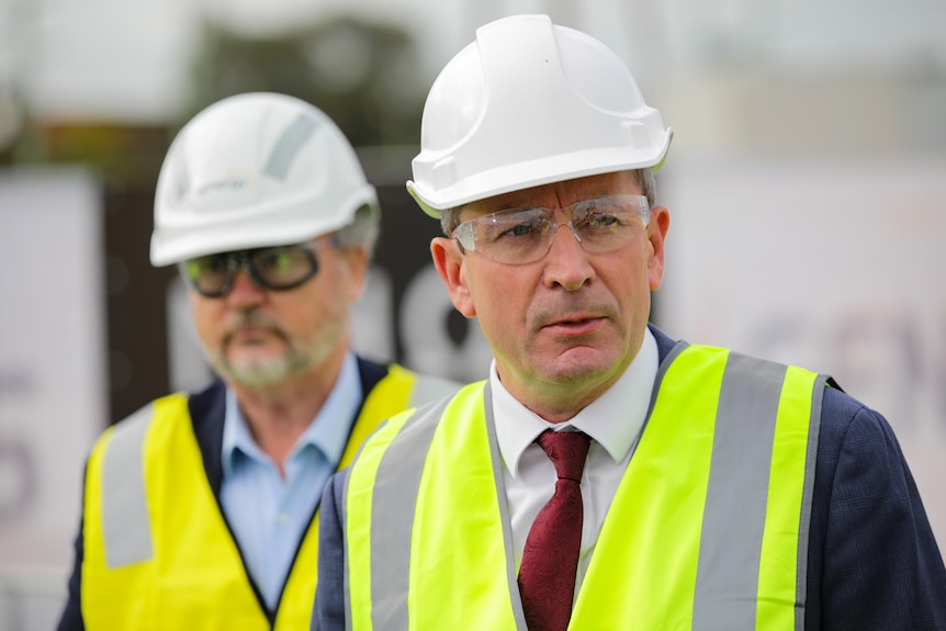 Mark McGowan and Bill Johnston wear high vis and hard hats