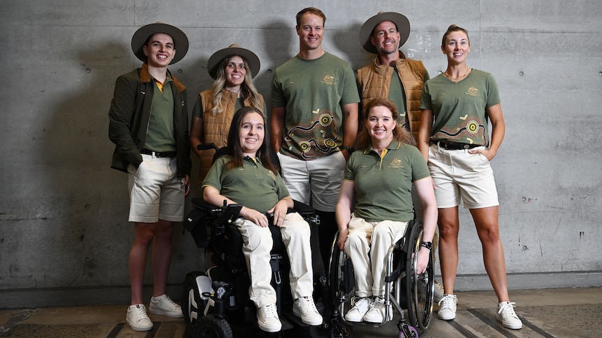 Seven members of the Australian Paralympic team pose wearing the formal uniform for the Paris Paralympics.