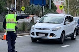 Police direct traffic at border check point in Coolangatta