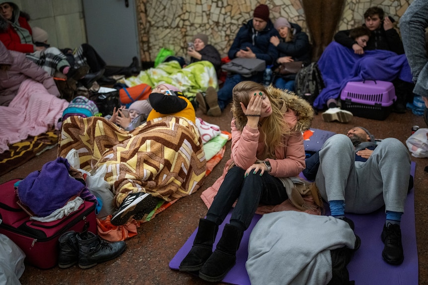 People rest in the Kyiv subway, using it as a bomb shelter