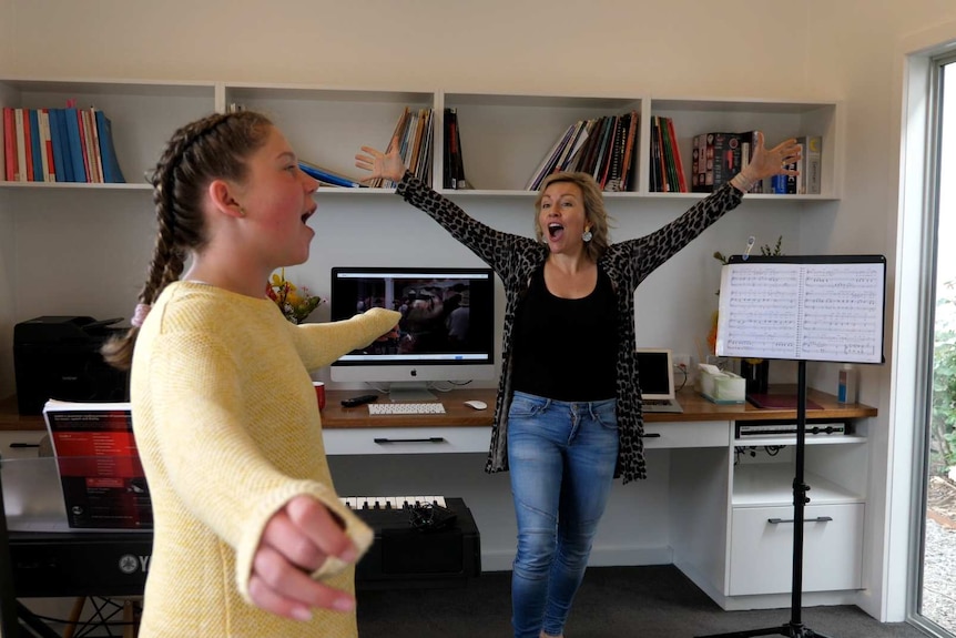 Young girl at singing lesson