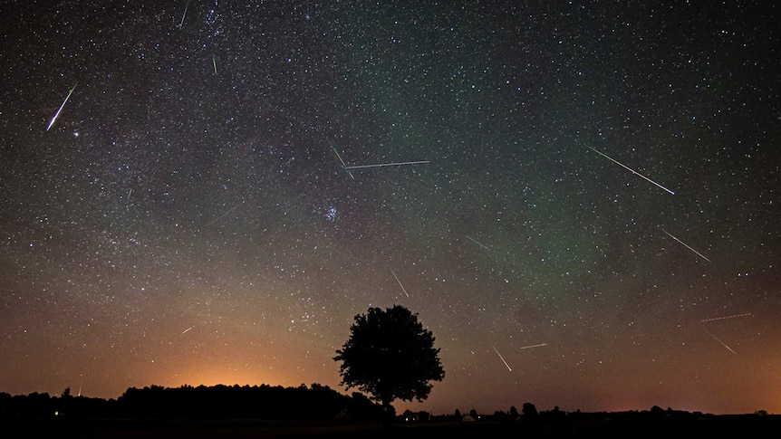 Meteor shower above horizon.