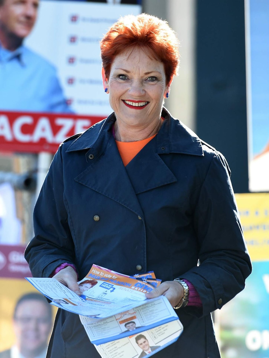 Pauline Hanson holding how-to-vote cards