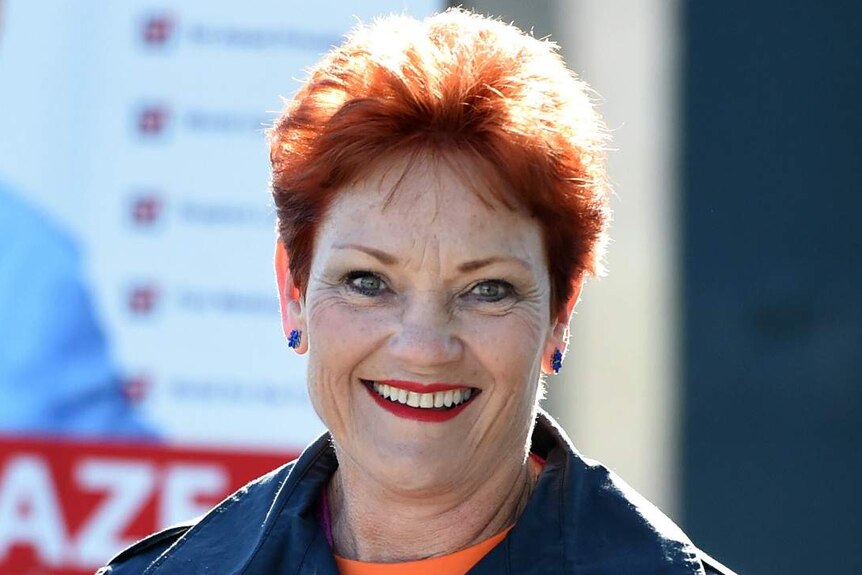 Pauline Hanson holding how-to-vote cards