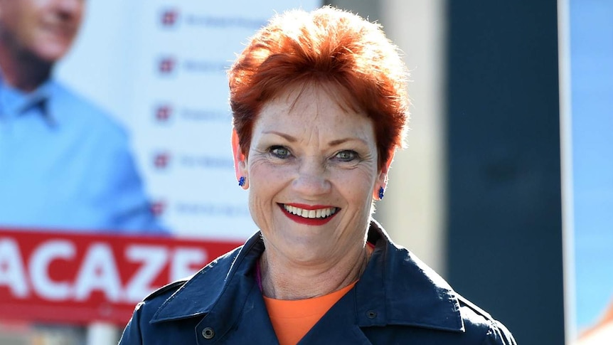 Pauline Hanson holding how-to-vote cards