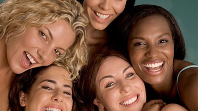 A group of multi-ethnic women smiling