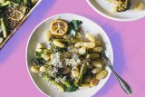 A bowl of baked gnocchi with broccoli and lemon, a one tray dinner ready in 30 minutes.