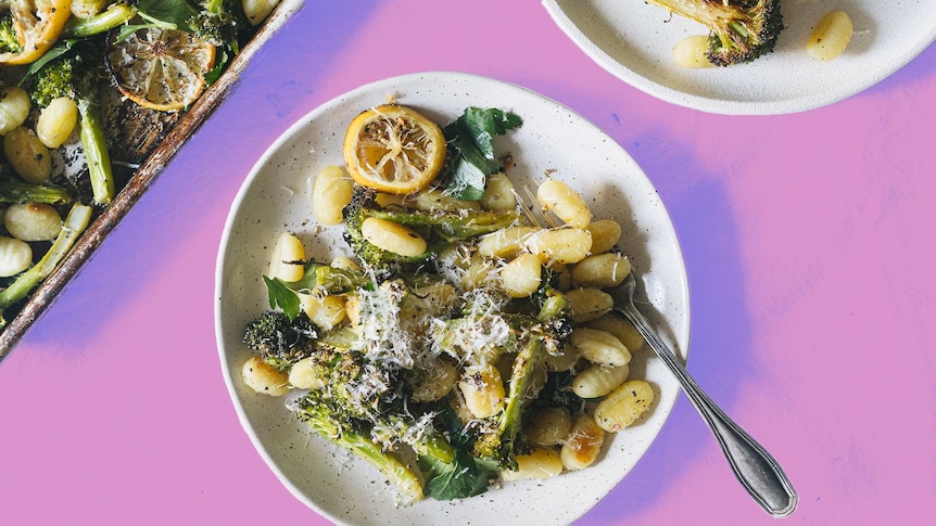 A bowl of baked gnocchi with broccoli and lemon, a one tray dinner ready in 30 minutes.