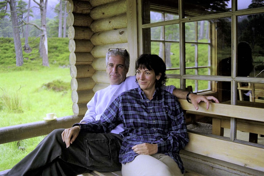 Jeffrey Epstein and Ghislaine Maxwell sitting together at a log cabin