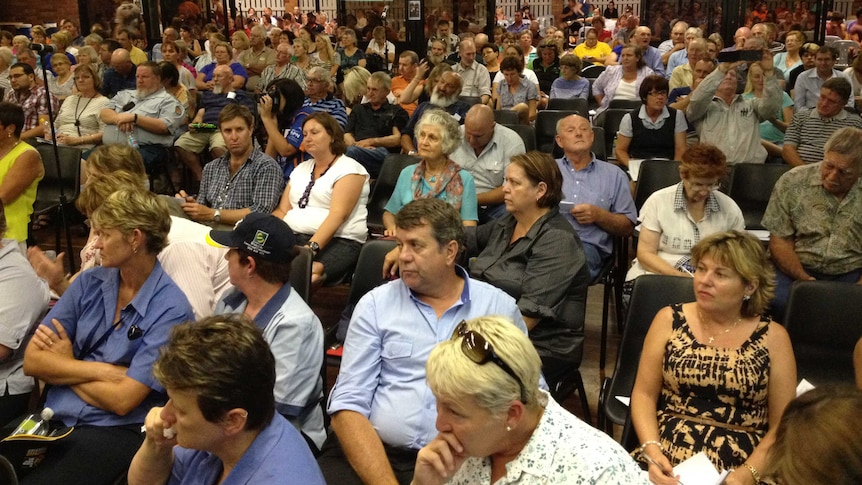 Last night about 500 people attended a meeting with health officials at Moura in central Queensland, concerned about the proposed closure of their hospital.