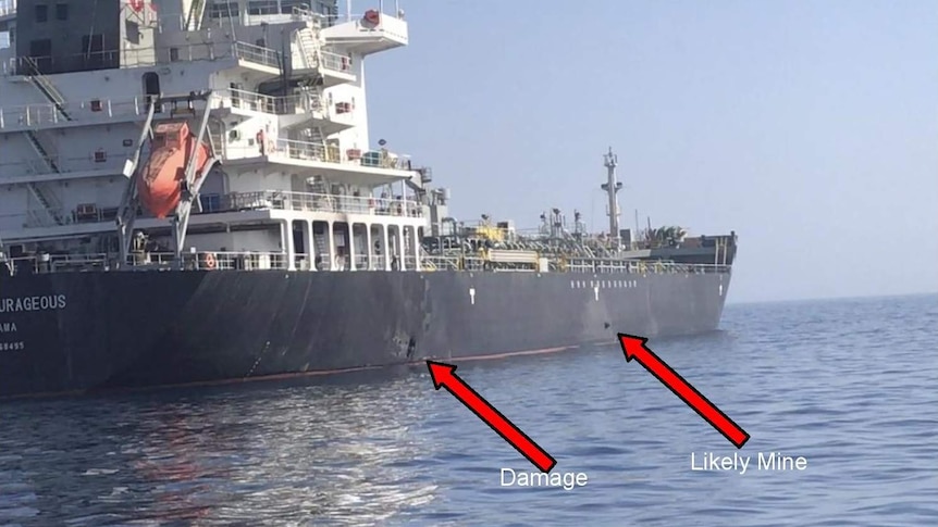A US Central Command photo shows alleged damage and an unexploded limpet mine on the ship's hull.