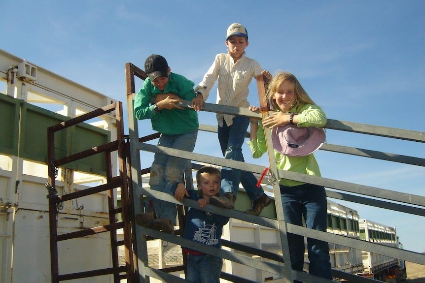 The four White children on a portable loading ramp at Mitchell Wells