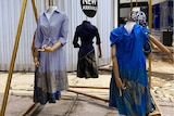 Dress mannequins with mud from floodwaters