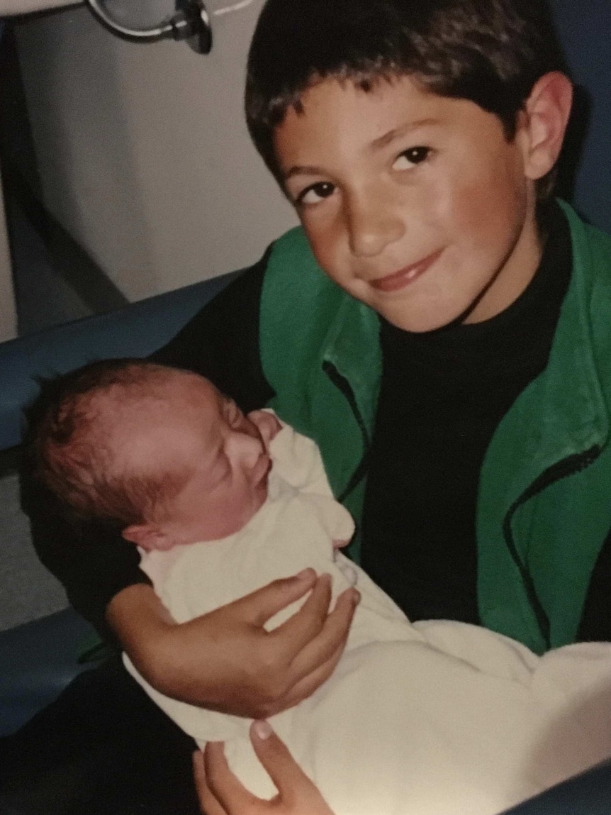 A young Braidon Fletcher with his new sister Bonny, undated photo.