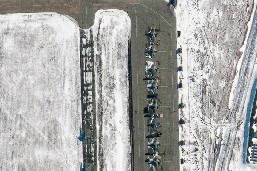 a view of su25 aircraft deployments are seen at an airfield strip.