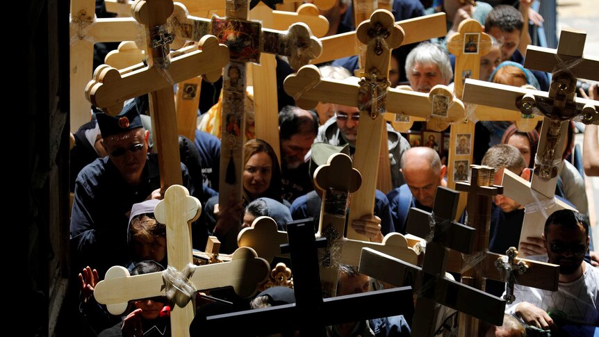 Worshippers carry crosses during the Good Friday procession through Jerusalem's Old City.