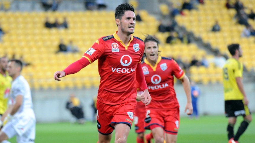 Adelaide United's Dylan McGowan celebrates his goal against the Phoenix in Wellington.
