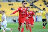 Adelaide United's Dylan McGowan celebrates his goal against the Phoenix in Wellington.