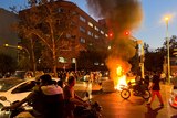 A police motorcycle burns during a protest over the death of Mahsa Amini in Iran.