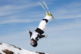 Moguls skier Britt Cox performing an aerial manoeuvre.