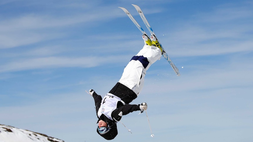 Moguls skier Britt Cox performing an aerial manoeuvre.