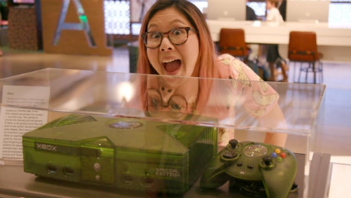 Rad grinning at an original xbox console