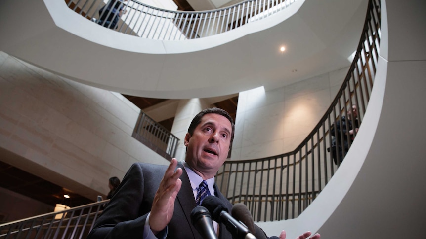 Devin Nunes speaks to reporters at the bottom of a stairwell.