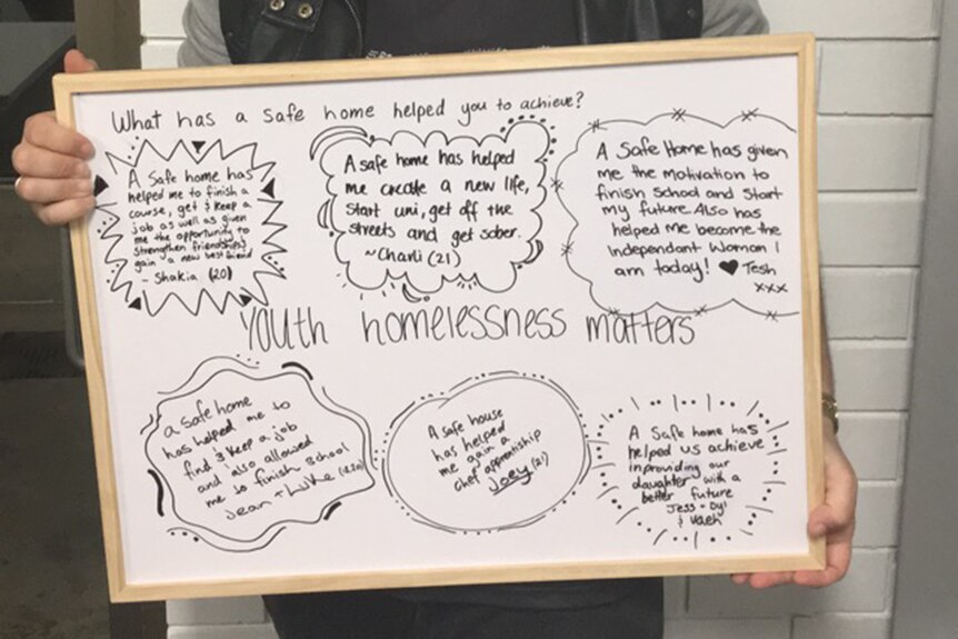 Whiteboard with notes about what having a safe home has meant to Shania, a young woman who had been homeless.