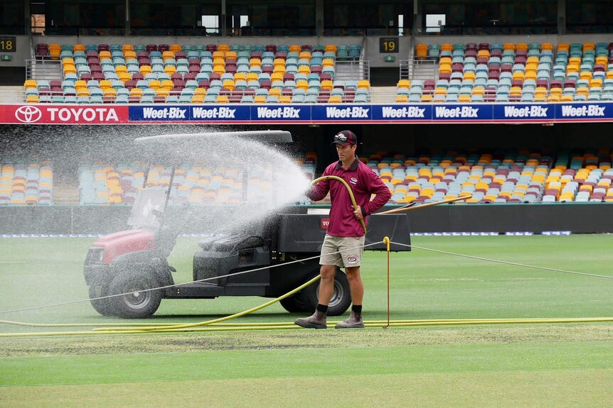 Brisbane cricket ground curator David Sandurski hoses the Gabba grounds in January 2018.