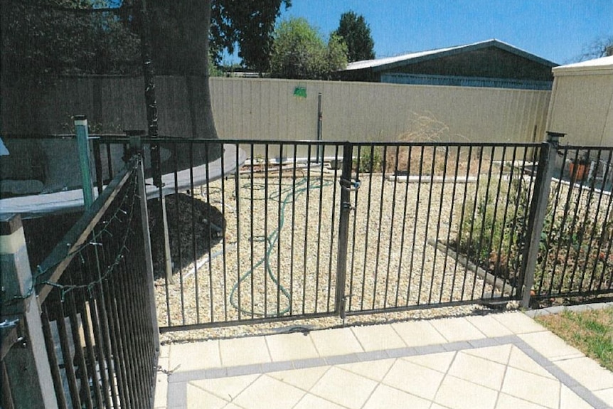 A backyard in Adelaide with a pool fenced off