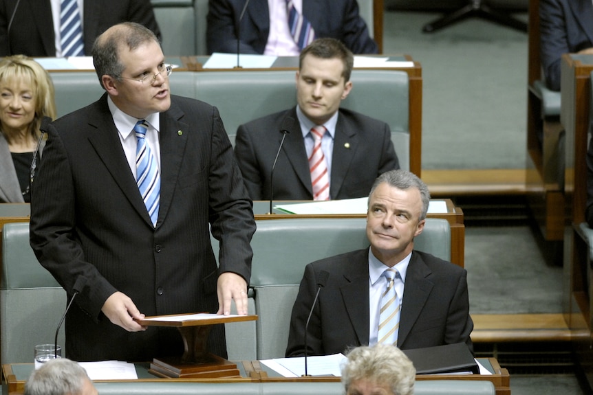 Scott Morrison in a blue tie speaks in the lower house chamber.
