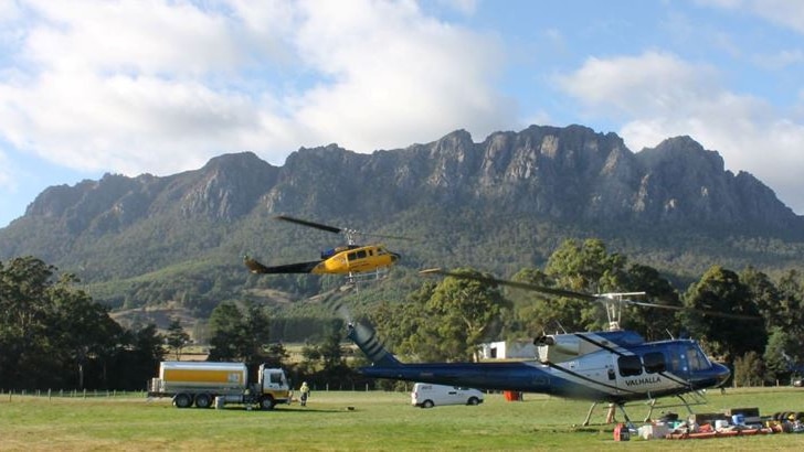 A helicopter takes off at the Vale airstrip at the base of Mount Roland, in north west Tasmania.