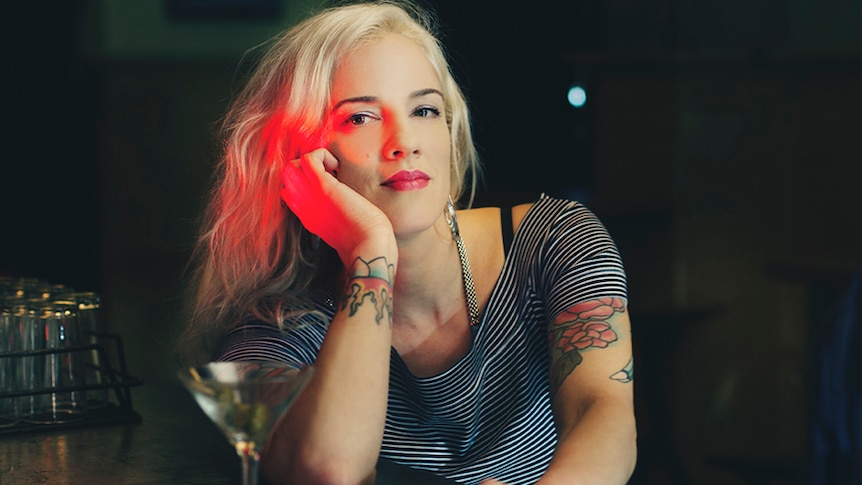 The author of new book Woman of Substances Jenny Valentish sits at a bar.