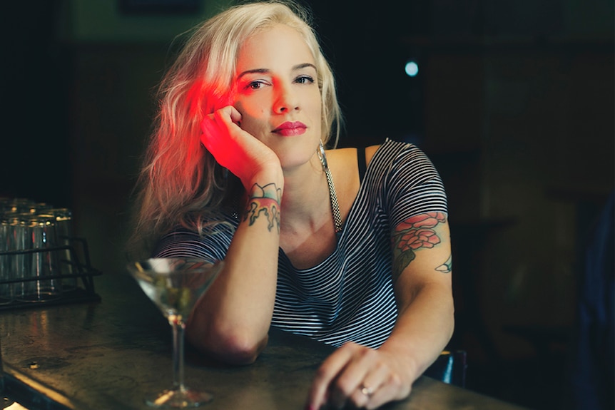 The author of new book Woman of Substances Jenny Valentish sits at a bar.