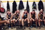 Crows players seated in rooms with bloodied knees for all