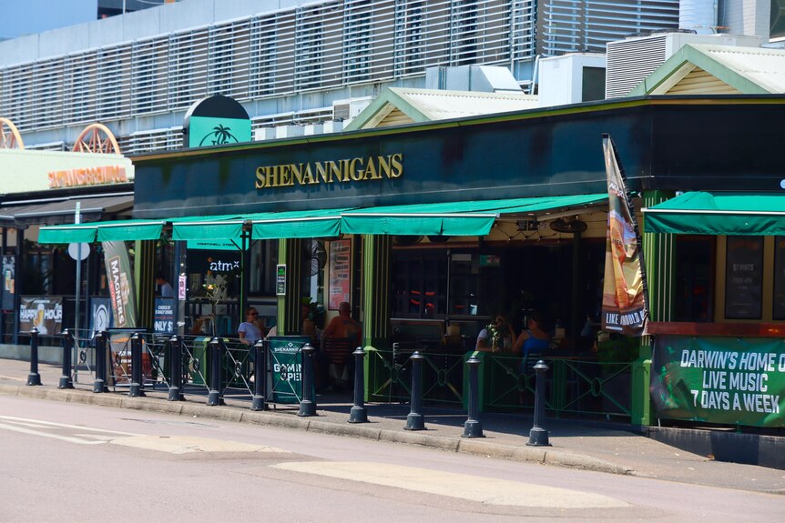 The exterior of an Irish pub, with a sign reading 'Shenannigans', in the Darwin city centre.