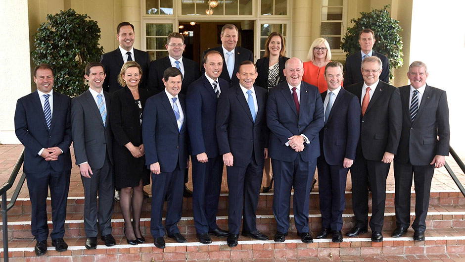 Prime Minister Tony Abbott and Governor-General Sir Peter Cosgrove pose with new cabinet members in December 2014.