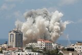 Smoke rises following what witnesses said was an Israeli air strike in Gaza City on August 9.