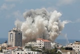 Smoke rises over a building in Gaza City