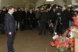 Russian President Dmitry Medvedev lays flowers at the Lubyanka metro station