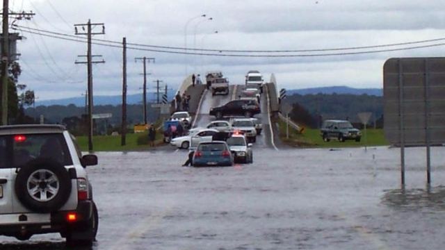 Motorists in floodwaters near Maitland.