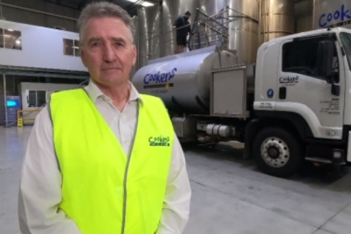 a man in front of a truck