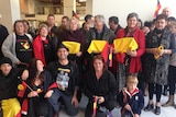 Supporters at Launceston airport welcome the return of Aboriginal remains repatriated from Chicago.