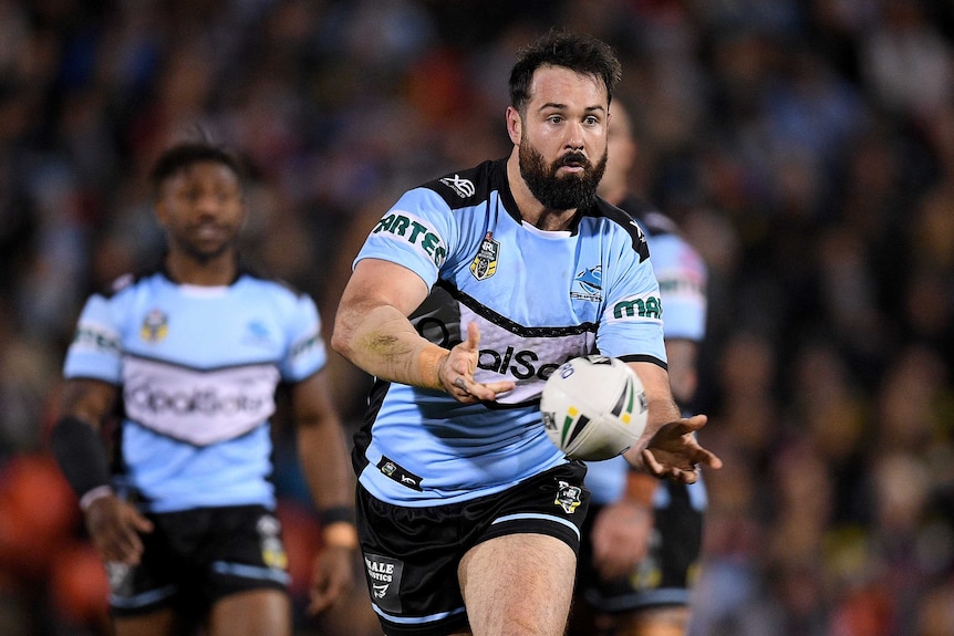 Aaron Woods makes a pass for the Sharks in their win over the Panthers.