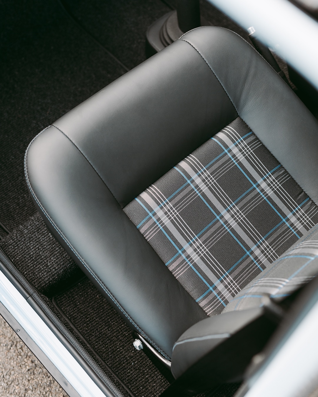 Grey and blue tartan on leather seats