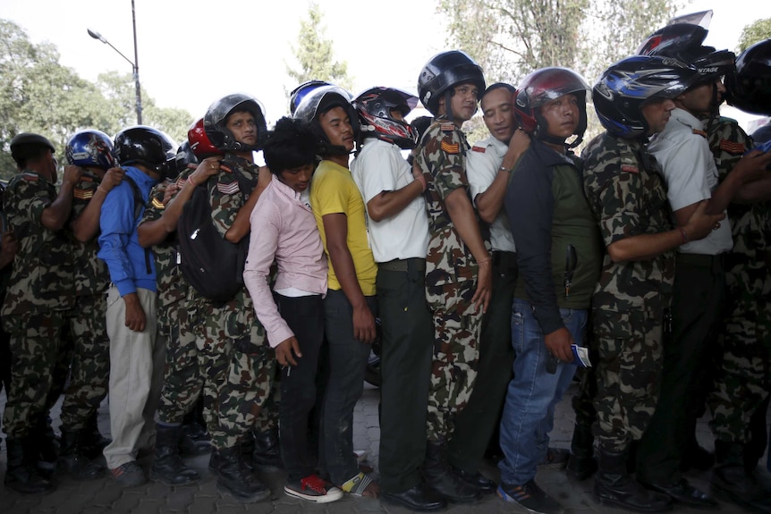 Motorists wait in line for fuel in Nepal