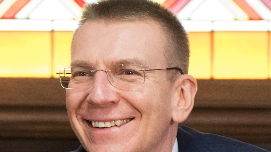 A headshot photo of the Foreign Minister of Latvia, Edgars Rinkēvičs, smiling